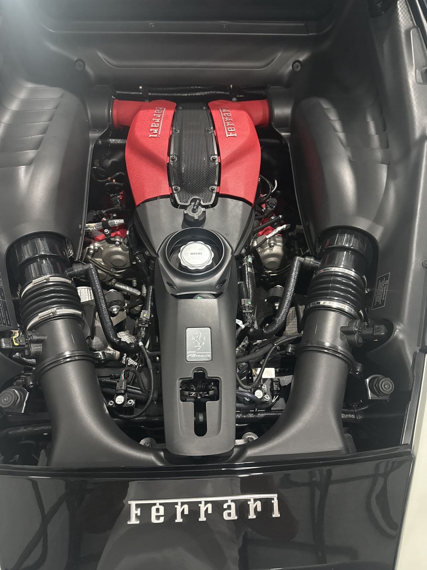 The twin-turbo V8 engine bay of a Ferrari F8 Tributo